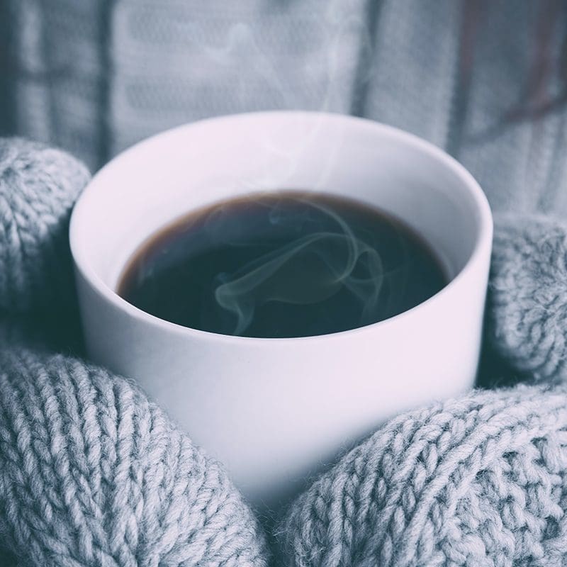 warm cup of coffee and fuzzy mittens warm cup of coffee and fuzzy mittens